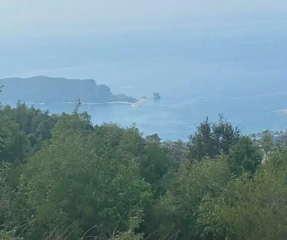 Land for sale in Budva, Montenegro, offering stunning panoramic views of the Adriatic Sea and surrou.