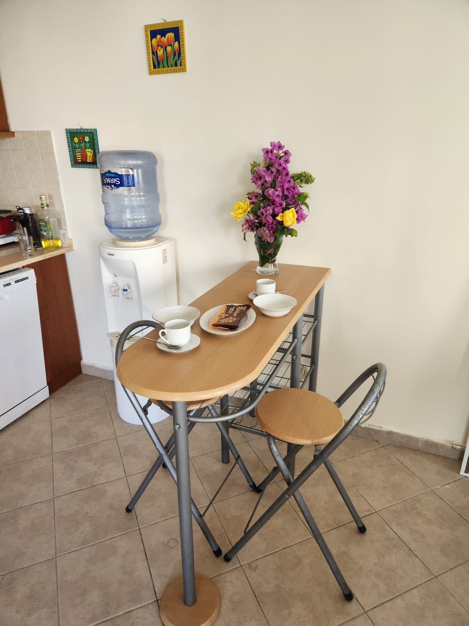 Luxury 3 Bed Villa for Sale in Grand Sea View Elegant dining area with fresh flowers in a luxury villa in Gumusluk. Perfect for relaxing and enjoy.