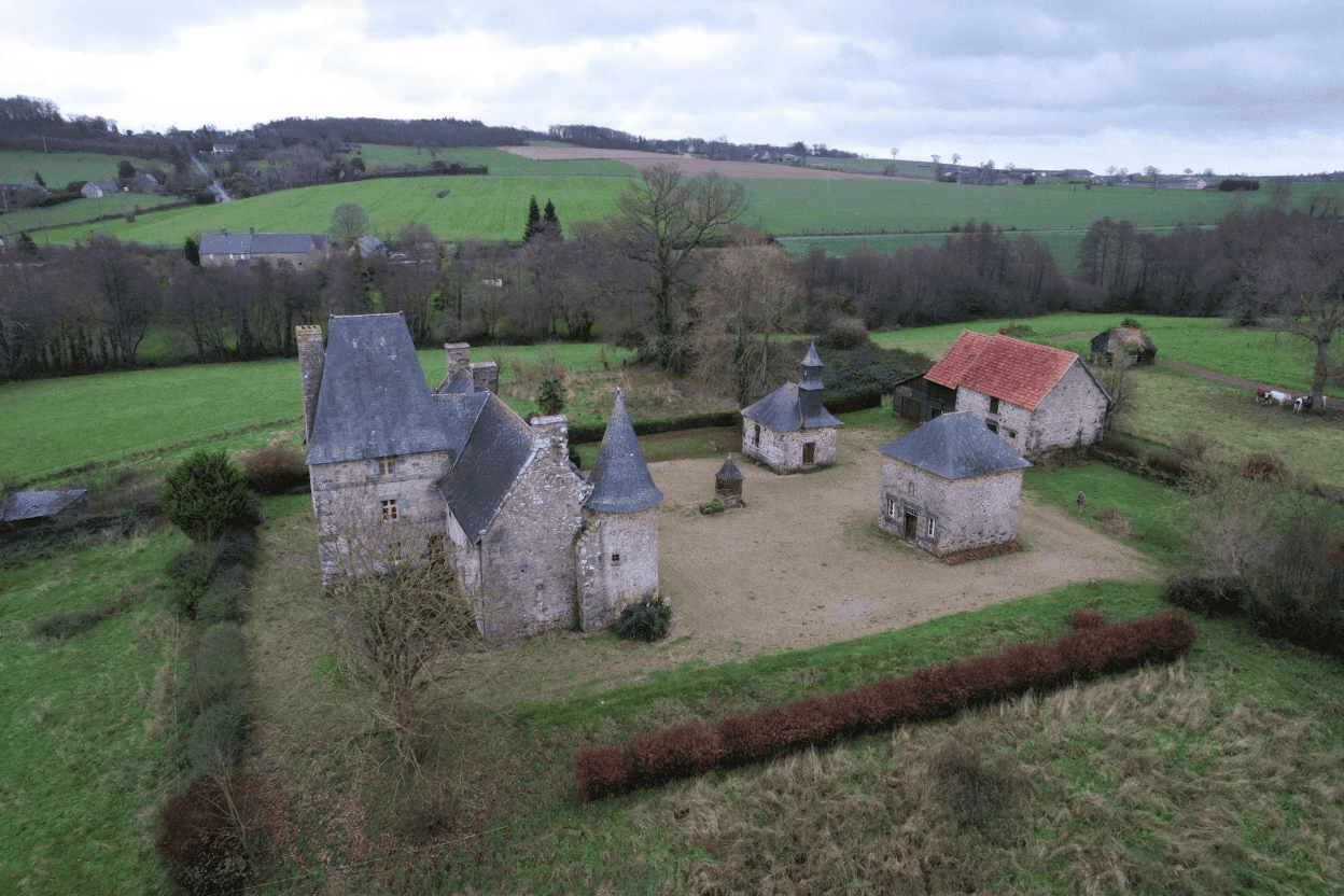 Luxury 5 Bed Le Manoir de Dougeru Style property with multiple towers and stone walls in Normandy.