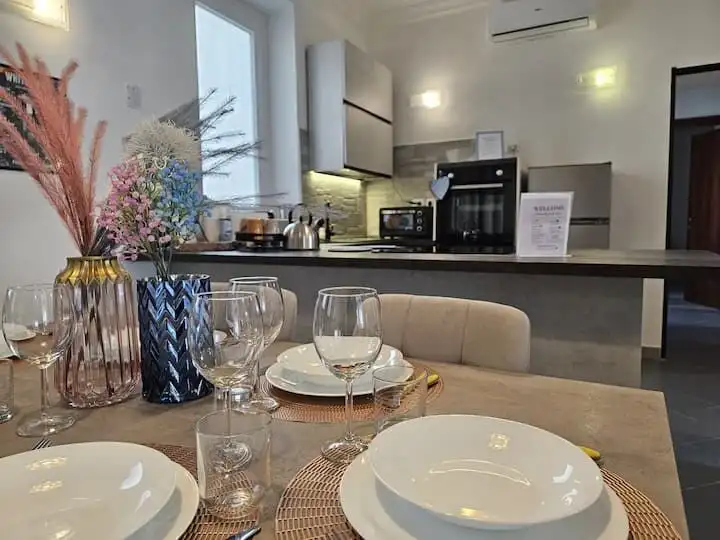 Stylish 3-bedroom apartment in Frascati Rome with contemporary kitchen and elegant dining area.