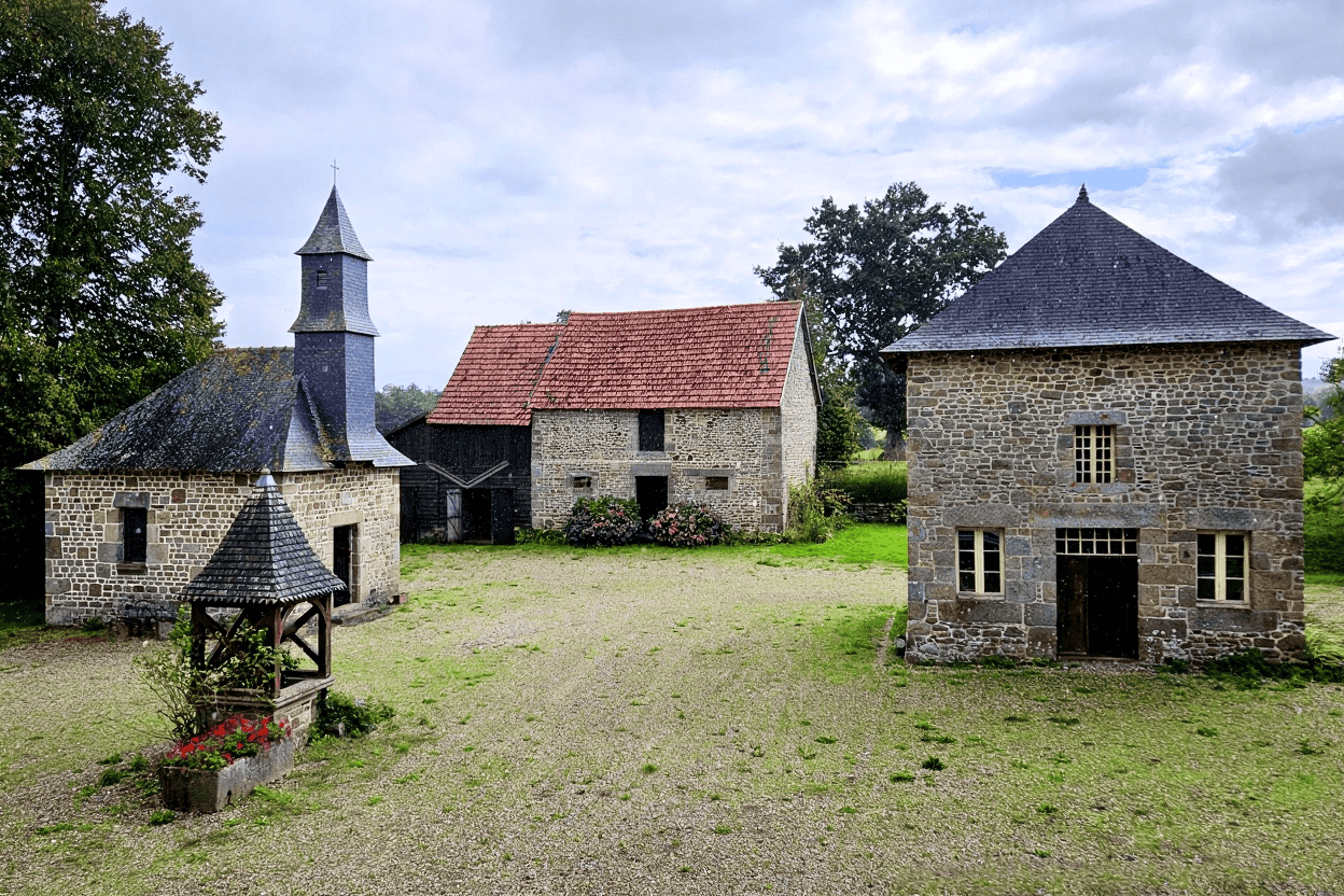 Luxury 5 Bed Le Manoir de Dougeru Charming stone manor house with lush gardens in Normandy for sale.