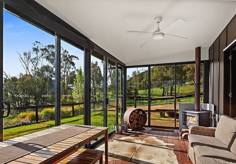 Elegant indoor living space with panoramic views of the estate.