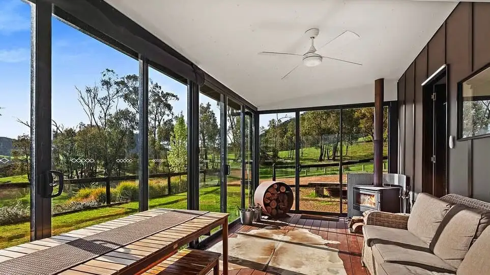 Elegant indoor living space with panoramic views of the estate.