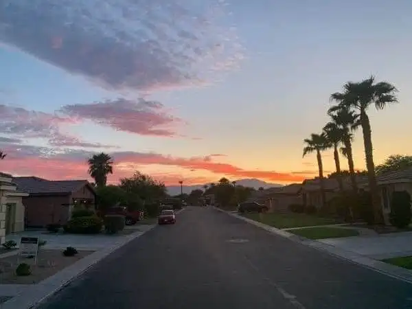 Beautiful sunset view over a quiet residential street in Indio, California.