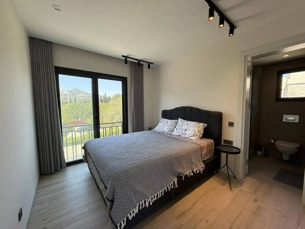 Elegant 2-bedroom apartment with sea views in Yalıkavak Bodrum. Modern interior, balcony, and close.