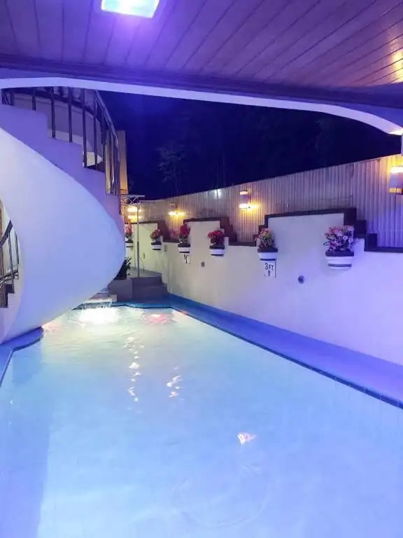Resort hotel pool area with modern design and ambient lighting in Cavite.