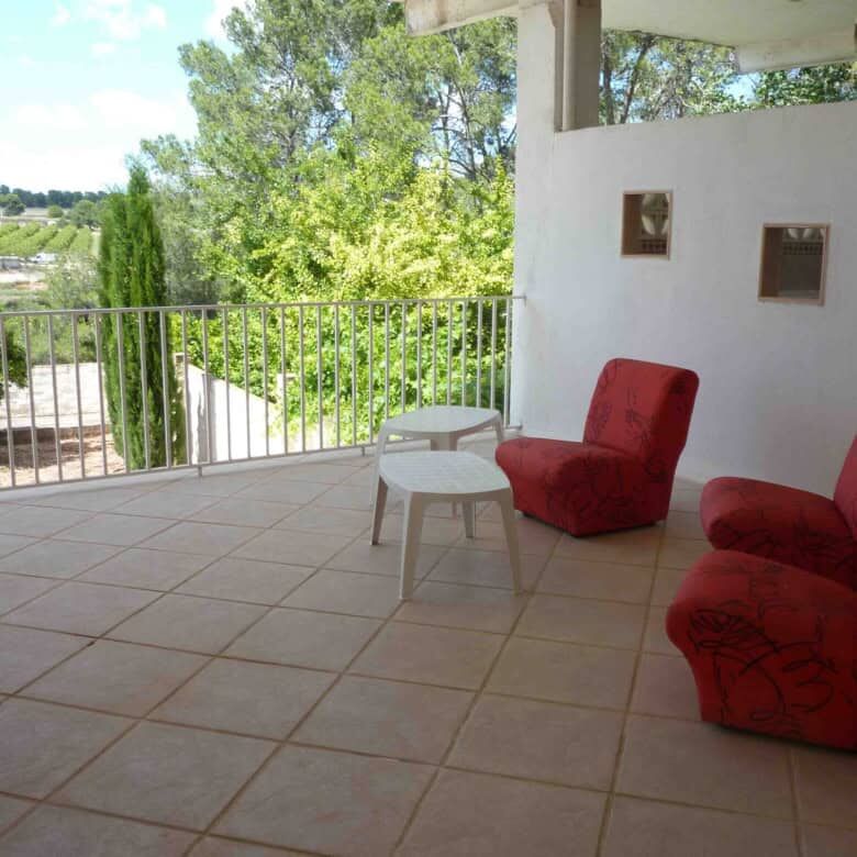Spacious outdoor terrace of a luxurious 6-bedroom villa in Valencia, perfect for relaxing and enjoyi.