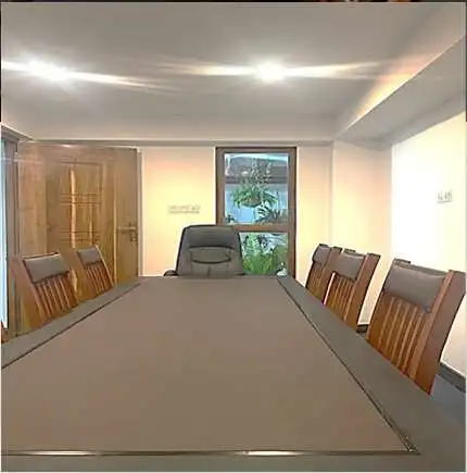 Modern conference room with a large table and wooden chairs in Colombo, Sri Lanka.