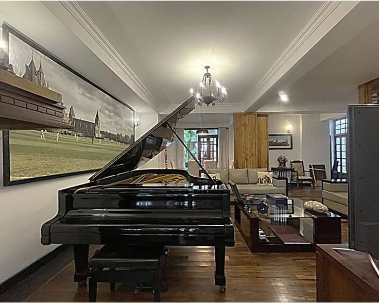 Elegant Colombo home with grand piano and stylish interior.