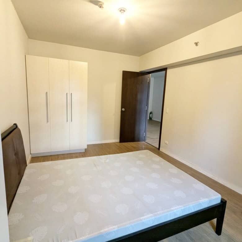 Spacious bedroom with minimalist design in Kroma Tower Manila, ideal for comfortable city living.