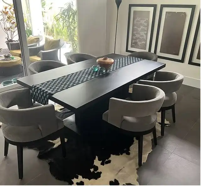 Elegant dining room with modern decor and natural light.