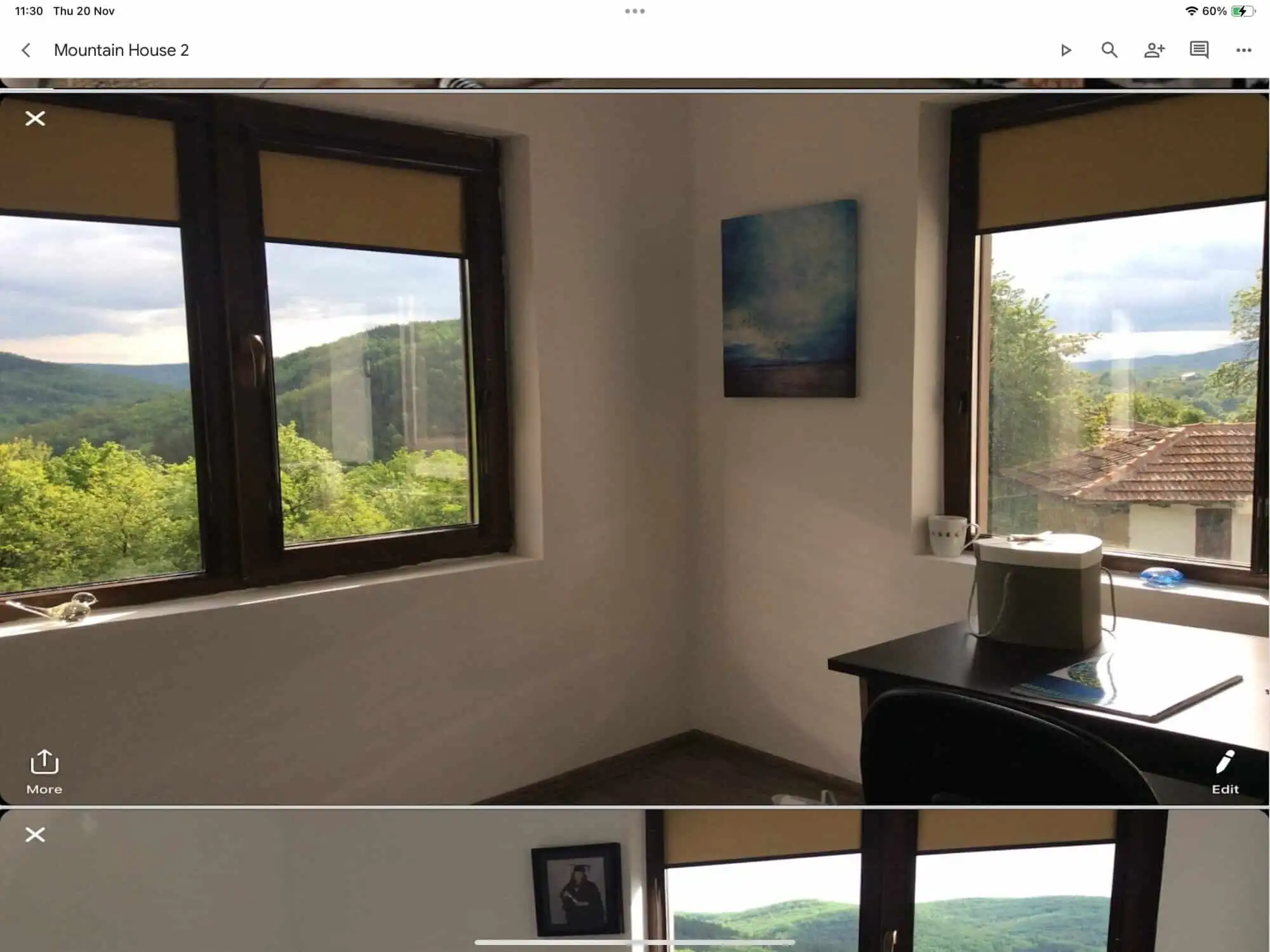 Bright room with large windows showcasing lush mountain scenery. Perfect for relaxing and enjoying n.