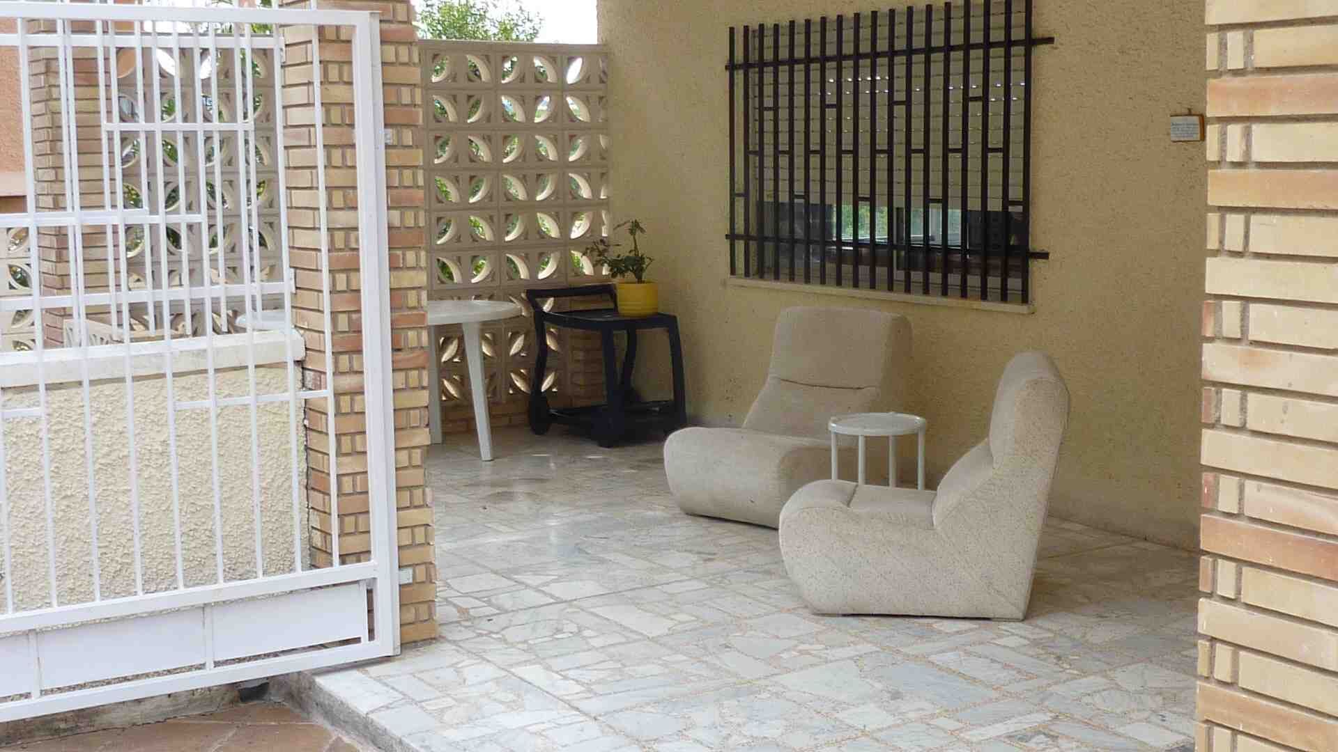 Elegant villa outdoor seating in Valencia Outdoor seating area with modern chairs in a Valencia villa.