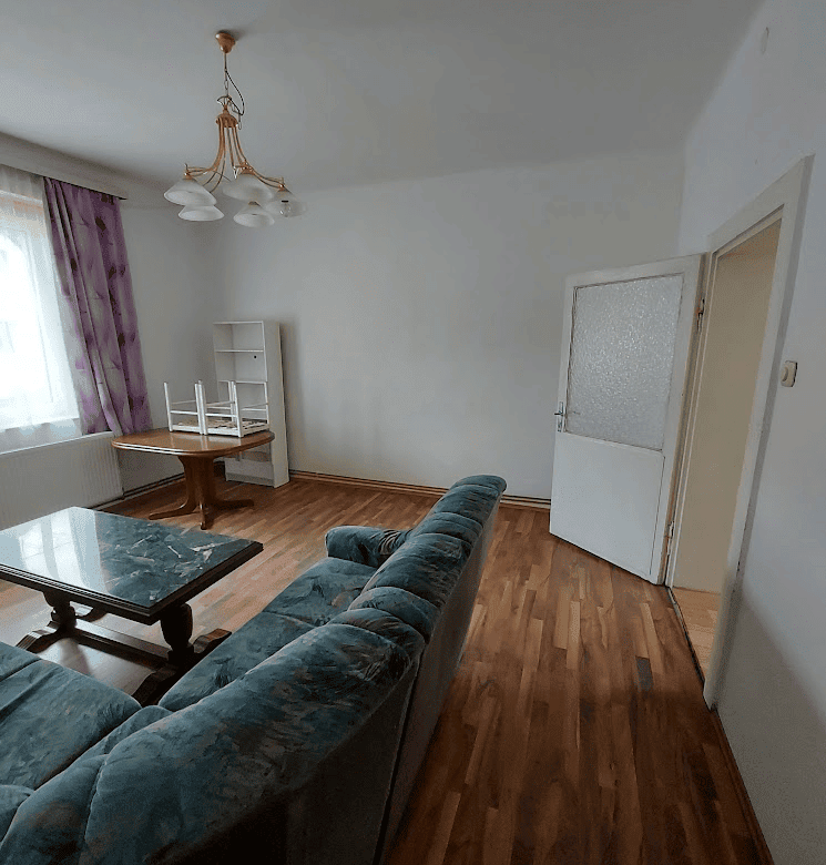 Apartment interior with living room and furniture in Wilhelmsburg.