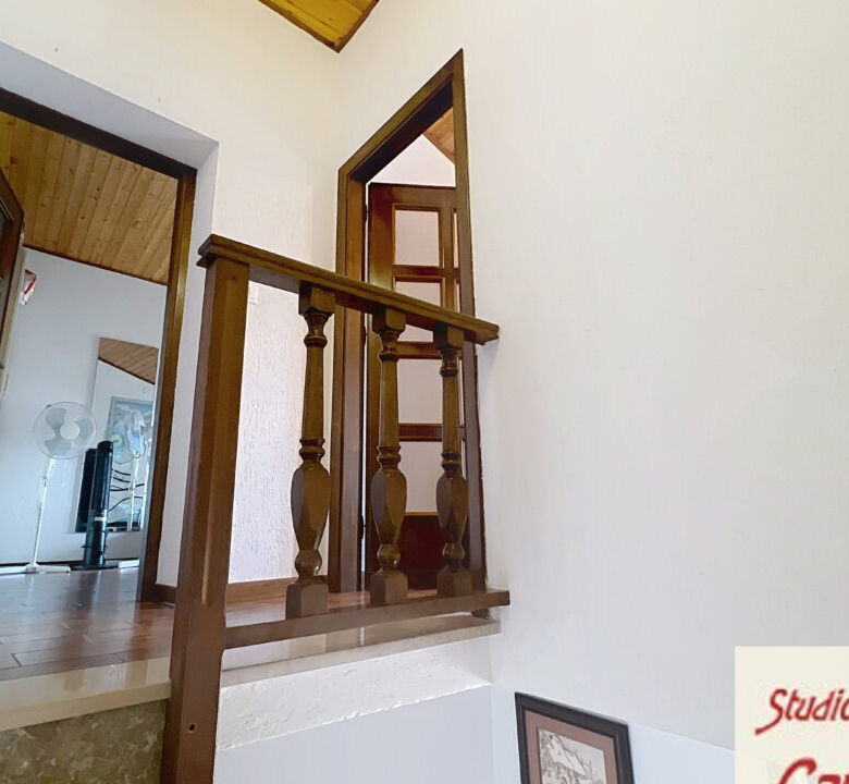 Charming 4-bedroom house interior in Fivizzano, Tuscany, showcasing traditional wooden staircase and.