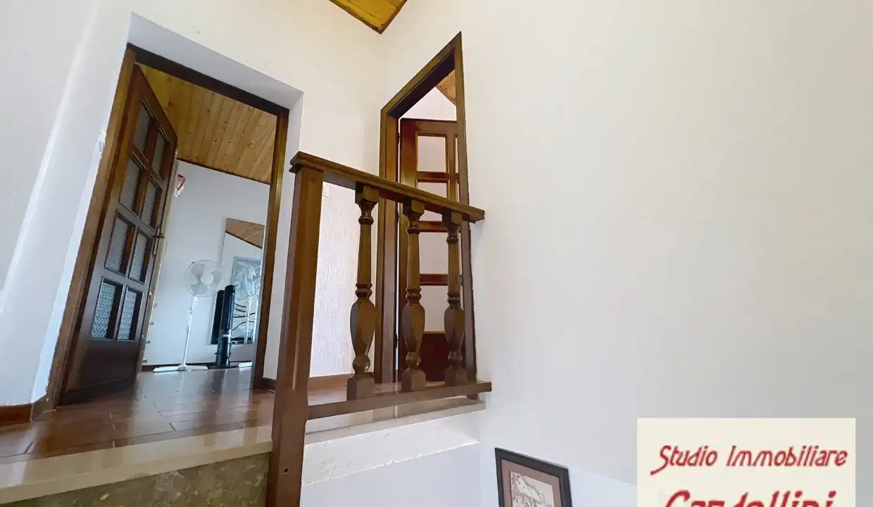Charming 4-bedroom house interior in Fivizzano, Tuscany, showcasing traditional wooden staircase and.