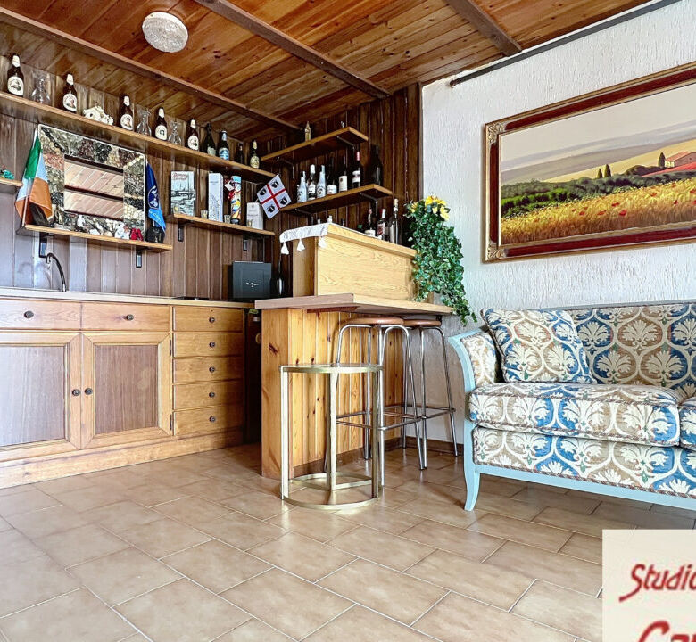 Beautiful interior of a 4-bedroom house in Fivizzano, Tuscany, featuring a cozy bar area and traditi.