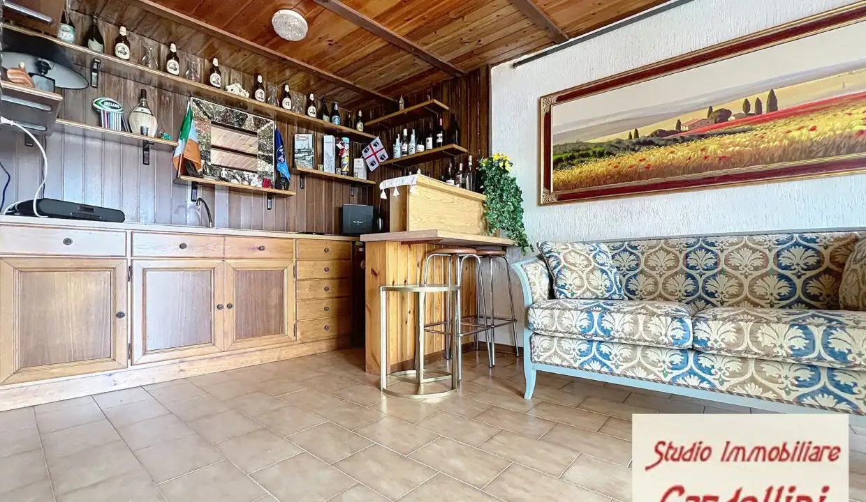 Beautiful interior of a 4-bedroom house in Fivizzano, Tuscany, featuring a cozy bar area and traditi.