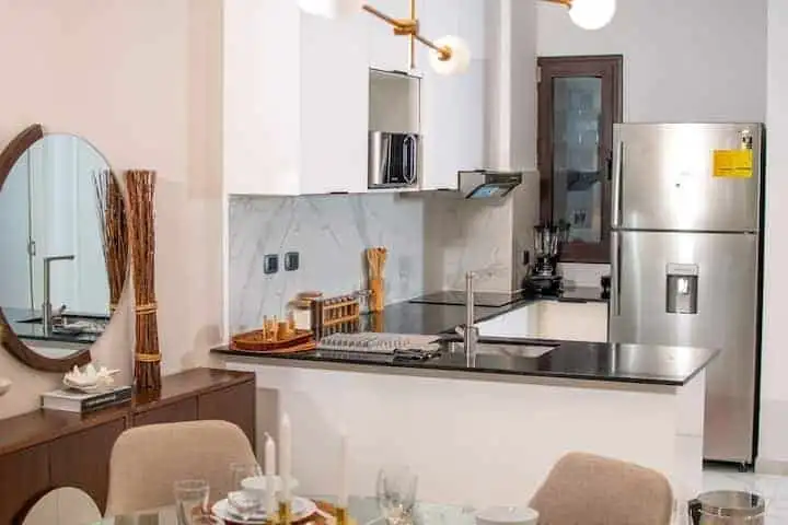 Spacious kitchen with contemporary appliances in Cana Rock STAR Punta Cana.