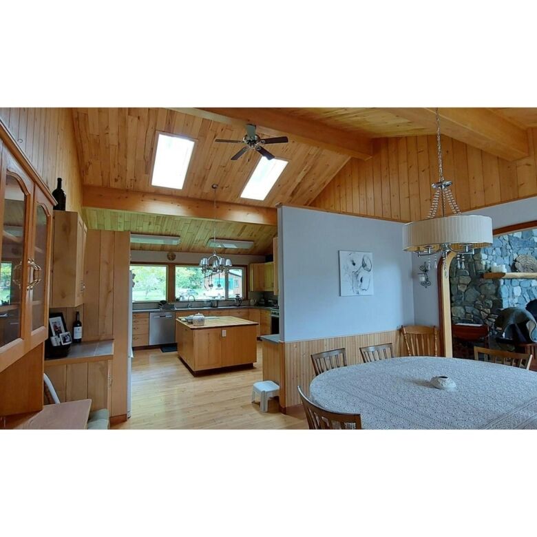 Spacious interior of a 4-bedroom estate with wooden accents in Bella Coola, British Columbia. Perfec.