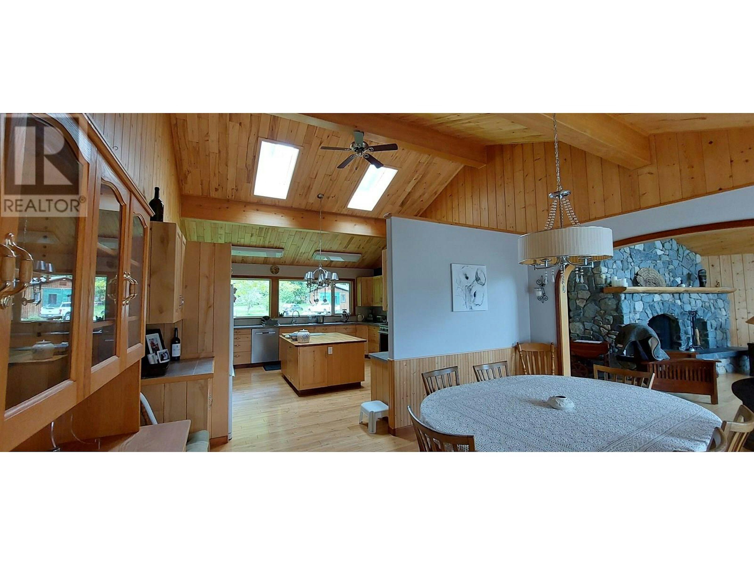 Cozy 4-Bedroom Estate in Bella Coola BC Spacious interior of a 4-bedroom estate with wooden accents in Bella Coola, British Columbia. Perfec.