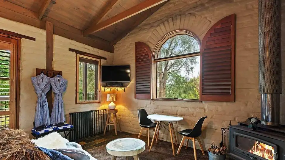 Elegant interior of a luxury 6-bedroom equestrian estate in Flowerdale, Victoria, featuring rustic w.