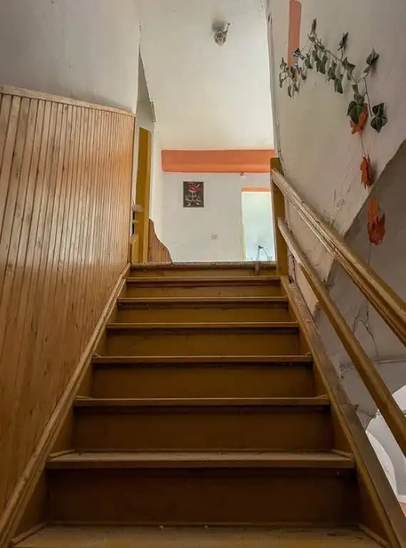 Spacious staircase inside an 11-bedroom estate ideal for redevelopment in Lubiechowa.