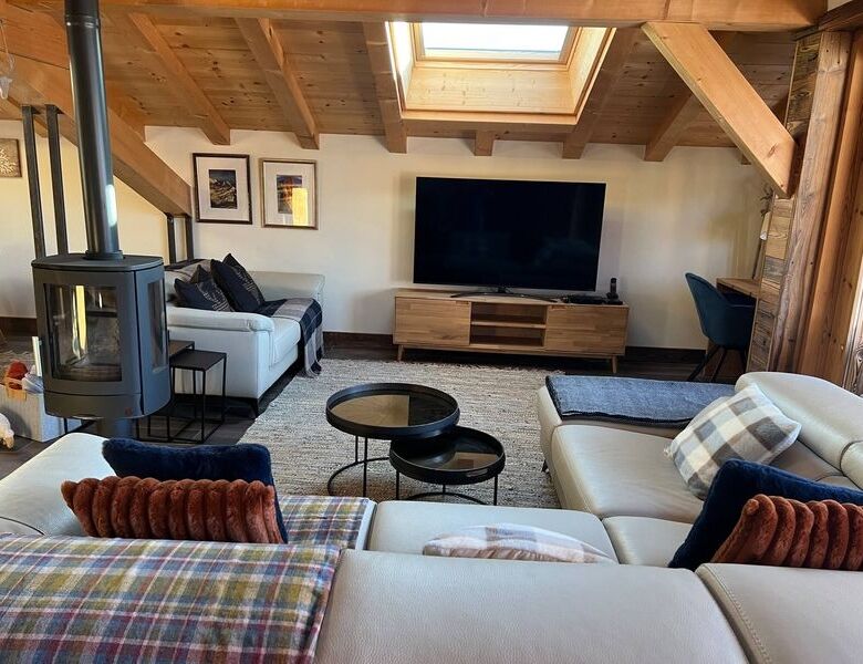 Charming interior of a luxury 5-bedroom chalet in Samoens with wooden accents and modern amenities.