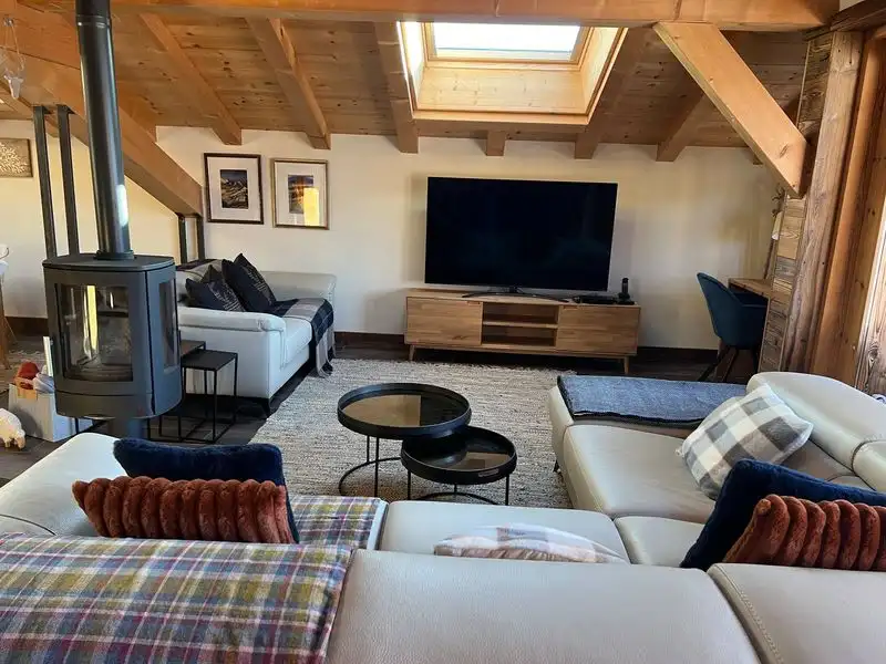 Charming interior of a luxury 5-bedroom chalet in Samoens with wooden accents and modern amenities.