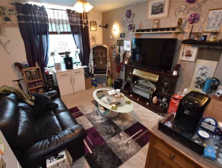 Bright living room in Leeds property with comfortable seating and decor.