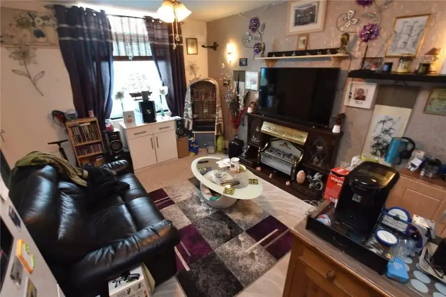 Bright living room in Leeds property with comfortable seating and decor.