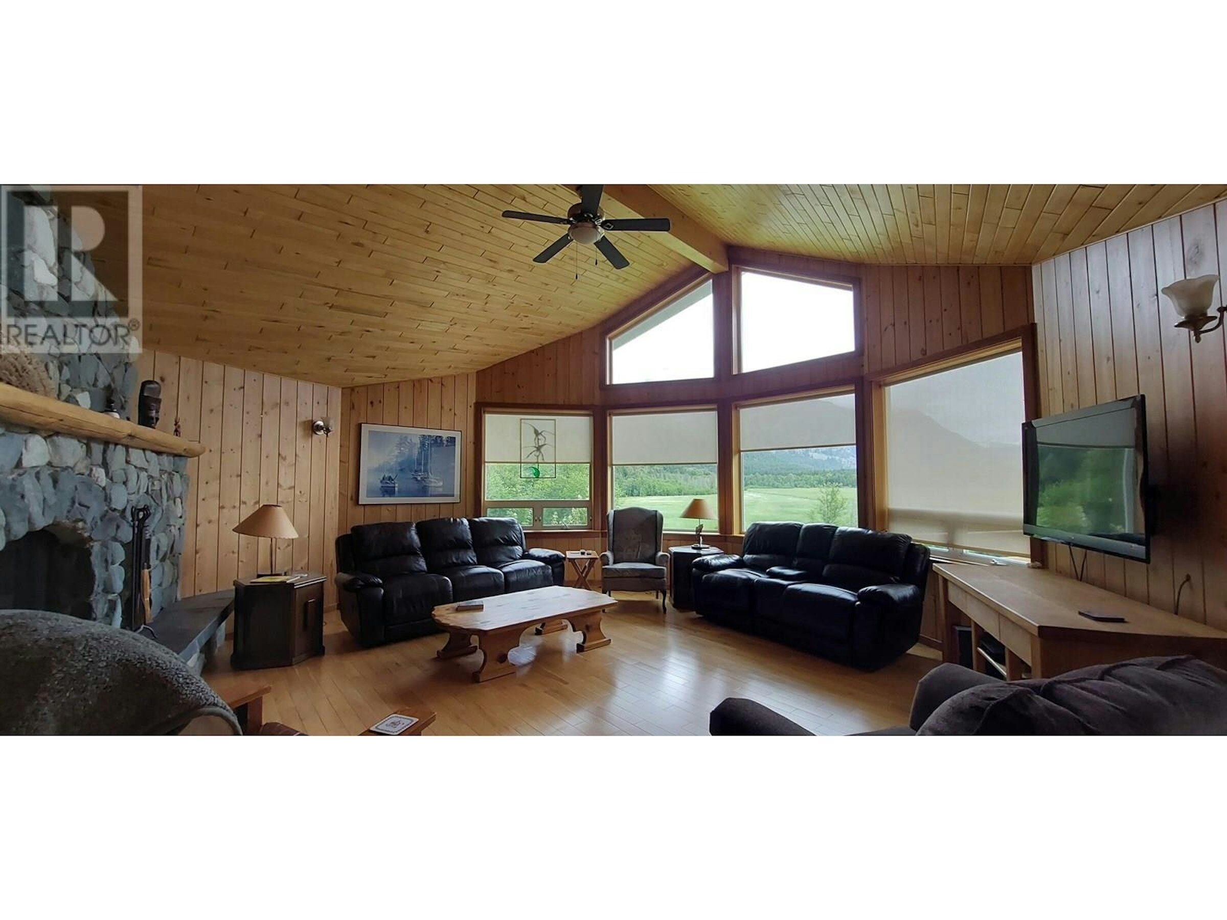 Cozy Living Room in Bella Coola Estate Spacious living room with large windows offering stunning views in this Bella Coola estate. Perfect.
