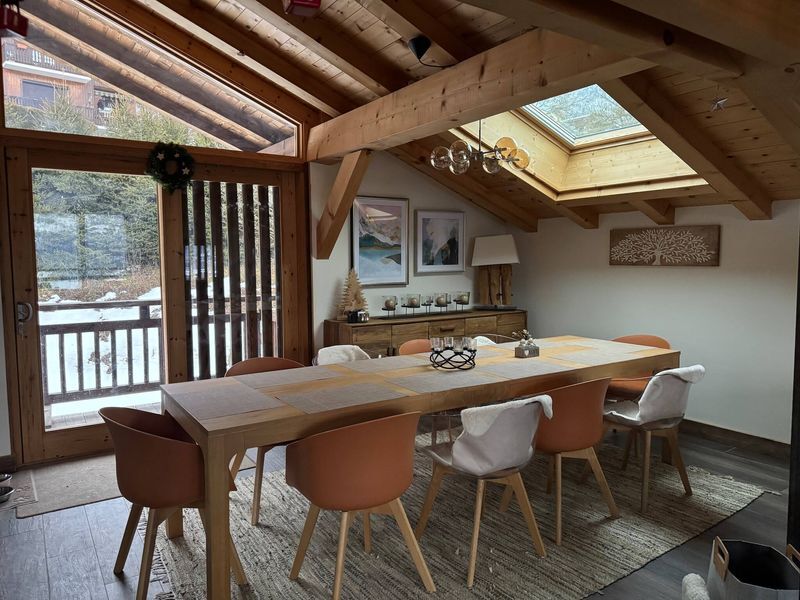 Luxury 5 Bed Chalet Dining Area Luxury 5 Bed Chalet Dining Area with wooden beams and skylights.