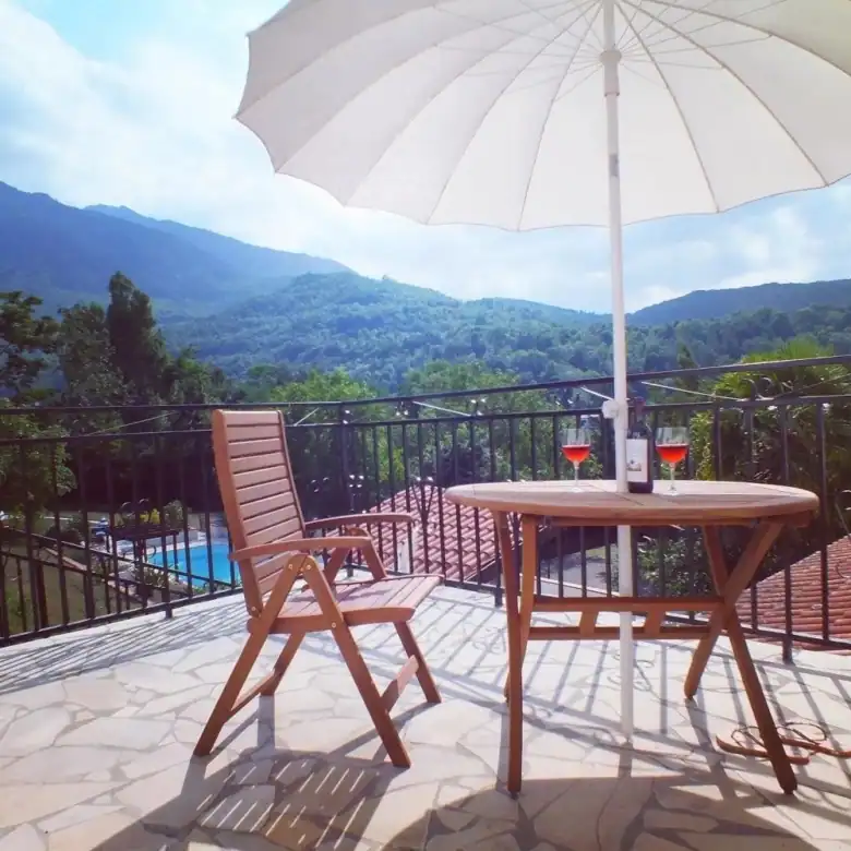 Beautiful terrace with mountain views and outdoor seating.