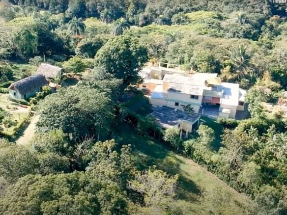 Aerial view of a luxurious park estate surrounded by lush greenery in the Dominican Republic.