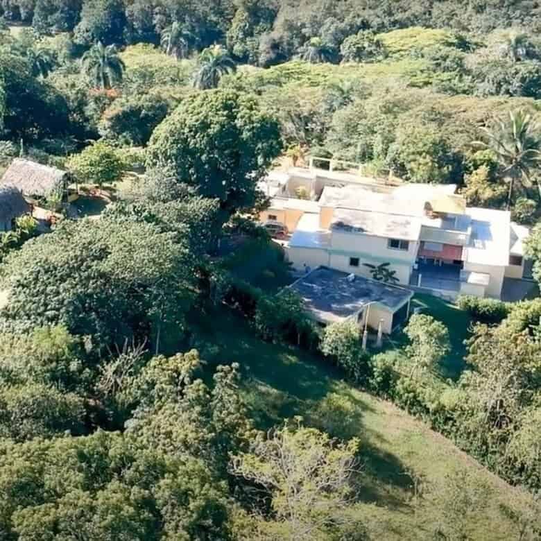 Aerial view of a luxurious park estate surrounded by lush greenery in the Dominican Republic.