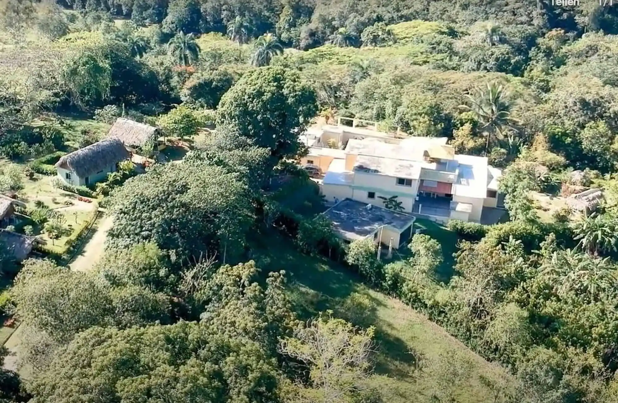 Aerial view of a luxurious park estate surrounded by lush greenery in the Dominican Republic.