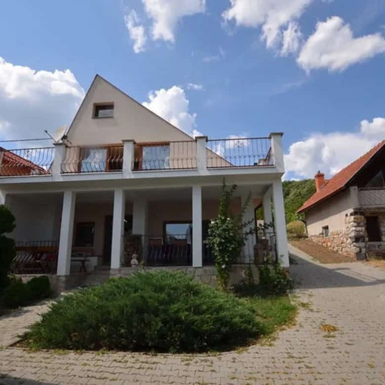 House with outbuildings, pool, and vineyard in Vinica, Slovakia, offering scenic views and rural tra.