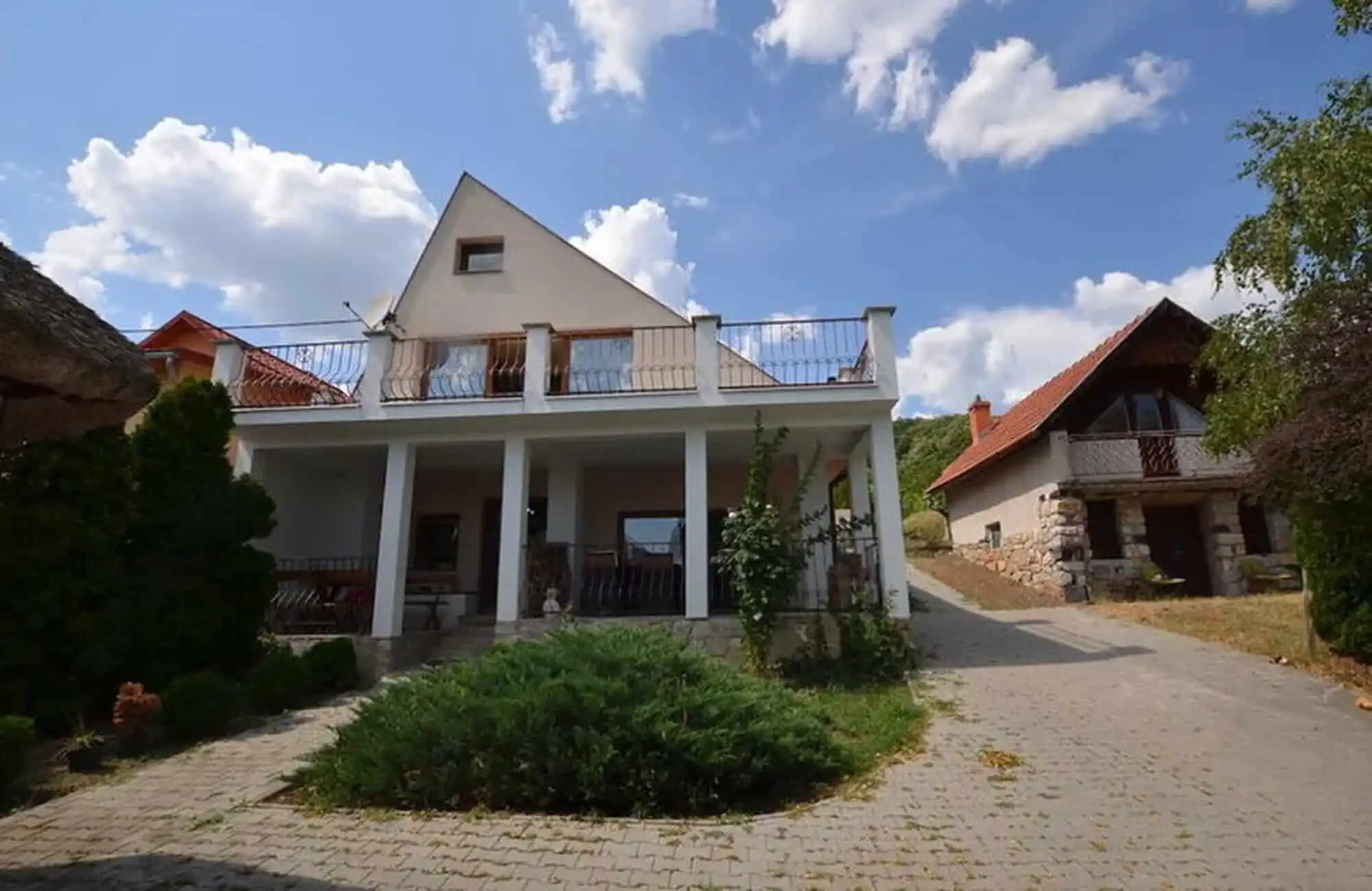 House with outbuildings, pool, and vineyard in Vinica, Slovakia, offering scenic views and rural tra.