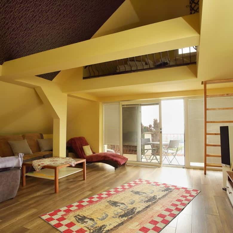 Bright living space with ample natural light and contemporary furnishings.