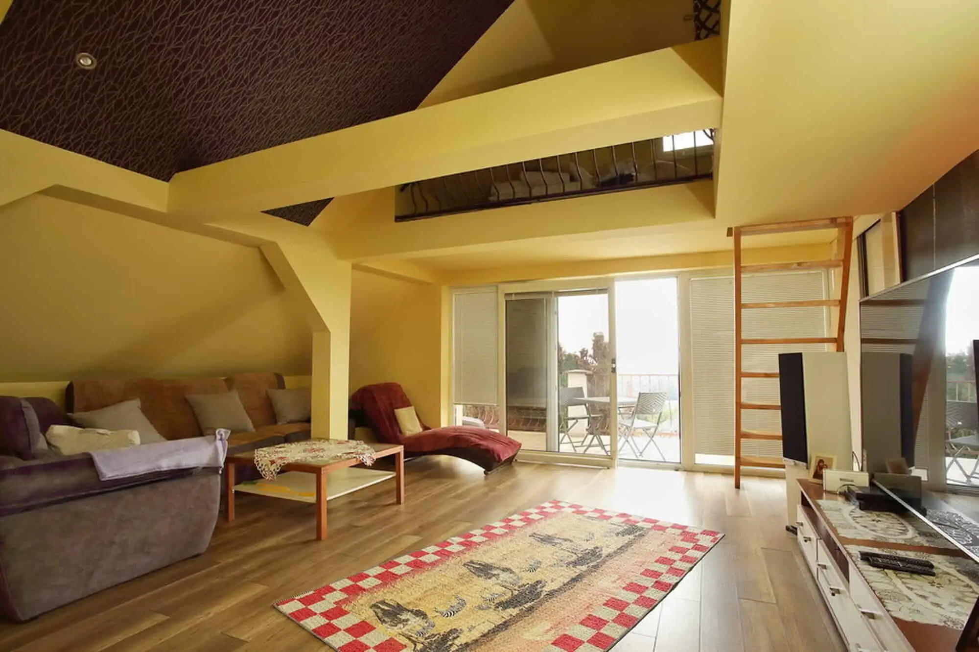Bright living space with ample natural light and contemporary furnishings.