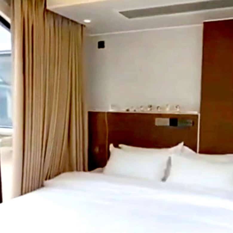 Comfortable hotel room with balcony overlooking tropical scenery in Martinique.