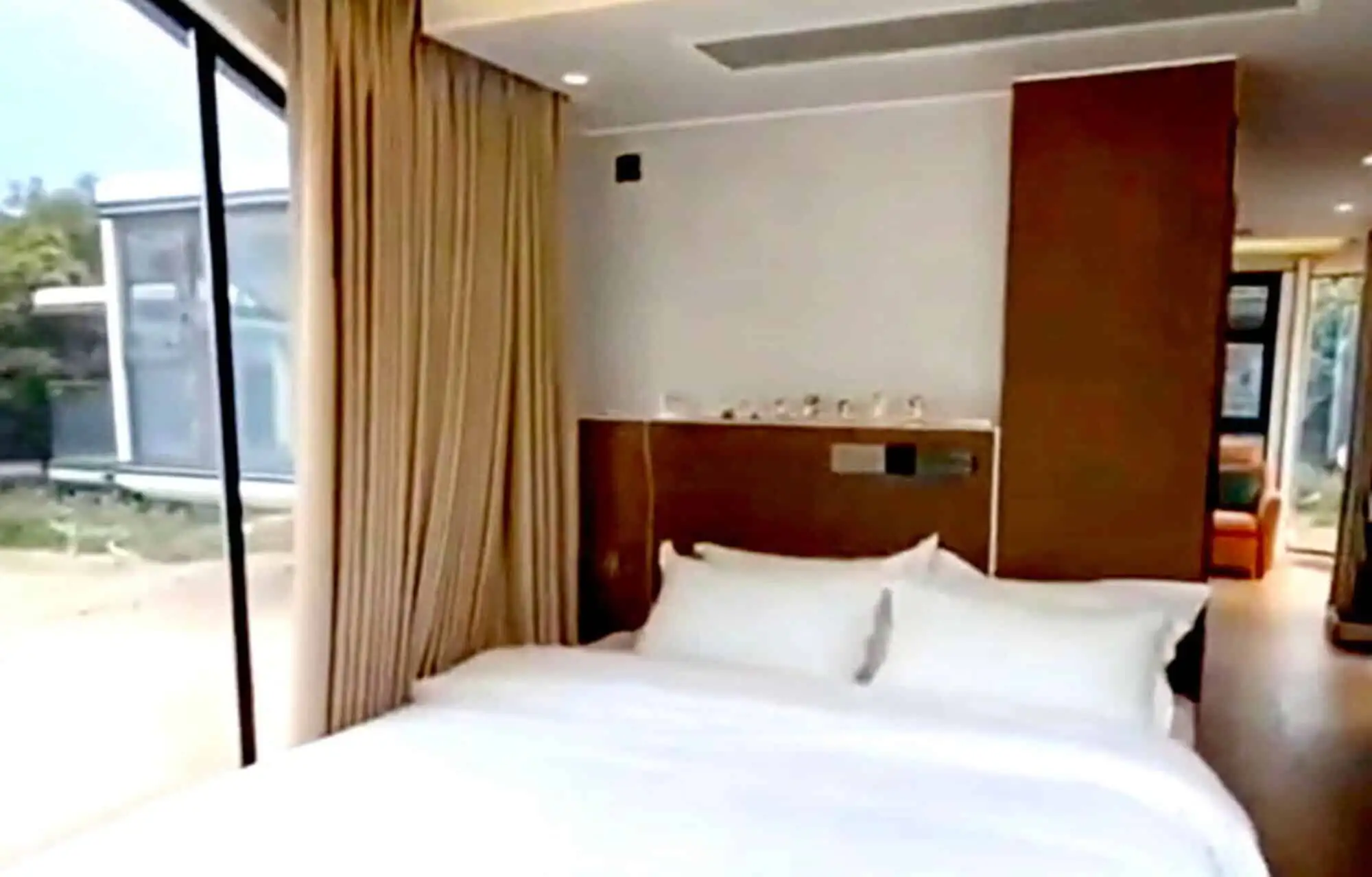 Comfortable hotel room with balcony overlooking tropical scenery in Martinique.