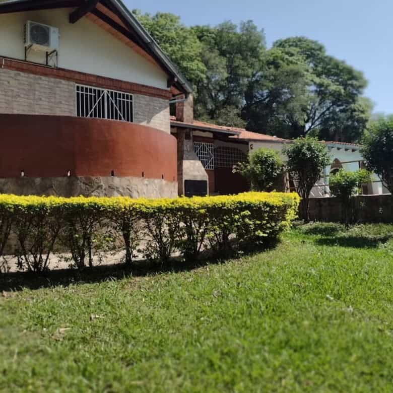 Beautiful property featuring two houses and lush land in Pirayu, Paraguay, ideal for investment or f.