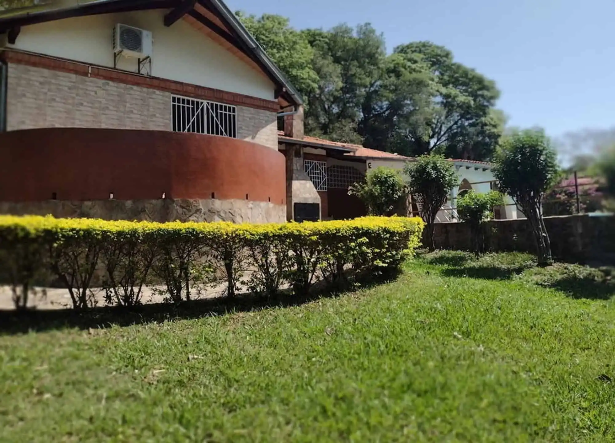 Beautiful property featuring two houses and lush land in Pirayu, Paraguay, ideal for investment or f.