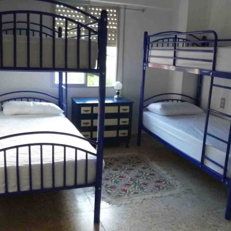 Interior view of a bedroom with bunk beds in a Valencia villa.