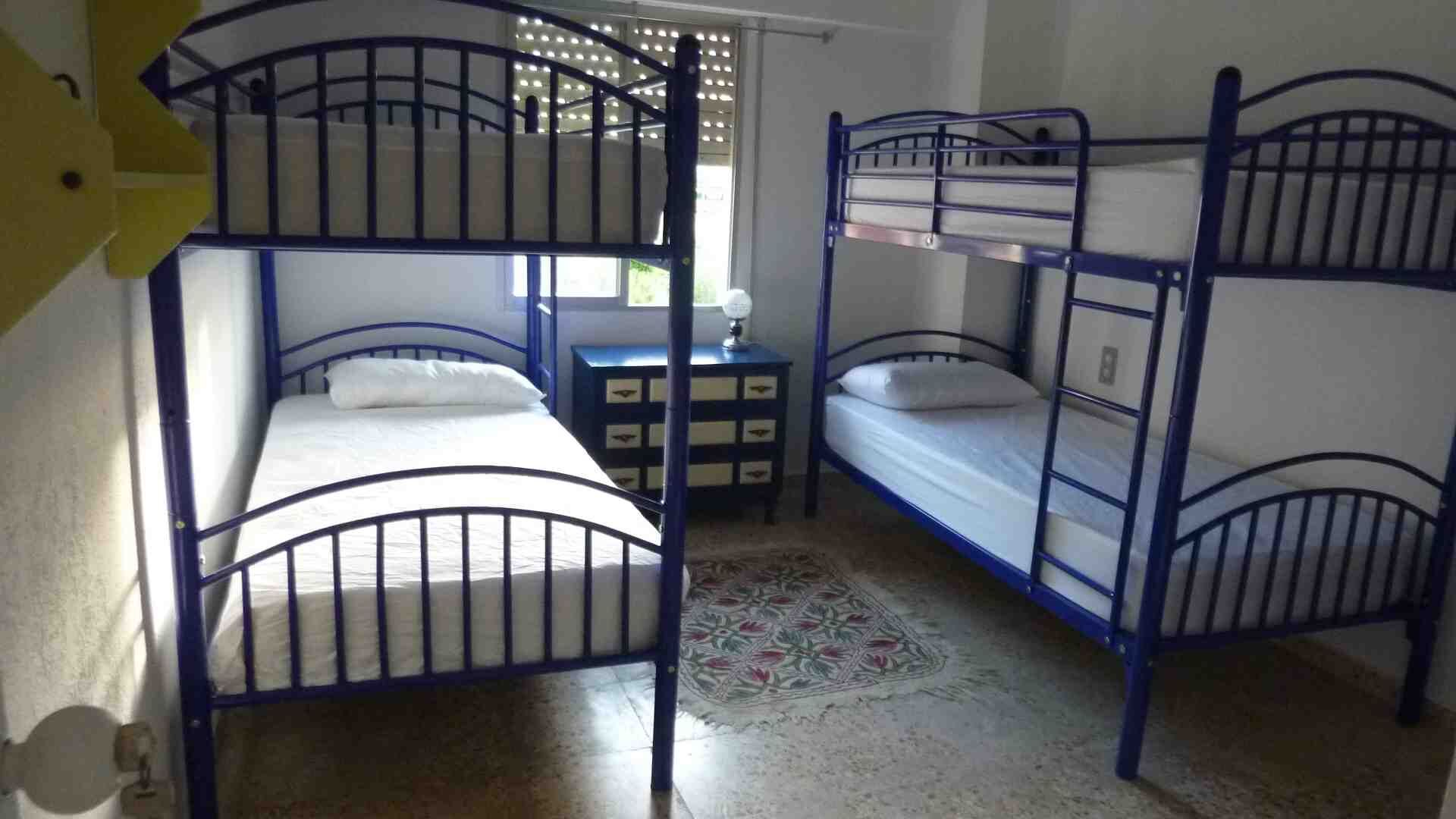 Villa for Sale in Valencia Interior view of a bedroom with bunk beds in a Valencia villa.