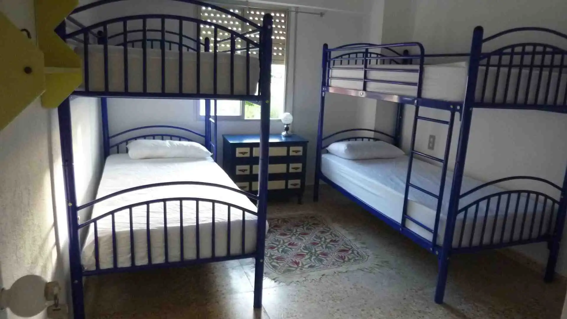 Interior view of a bedroom with bunk beds in a Valencia villa.