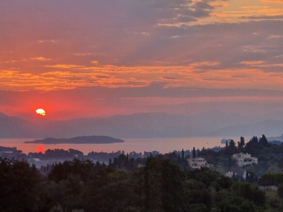 View villa in Gouvia, Corfu, during sunset. Fully renovated with stunning views of the Ionian Sea an.