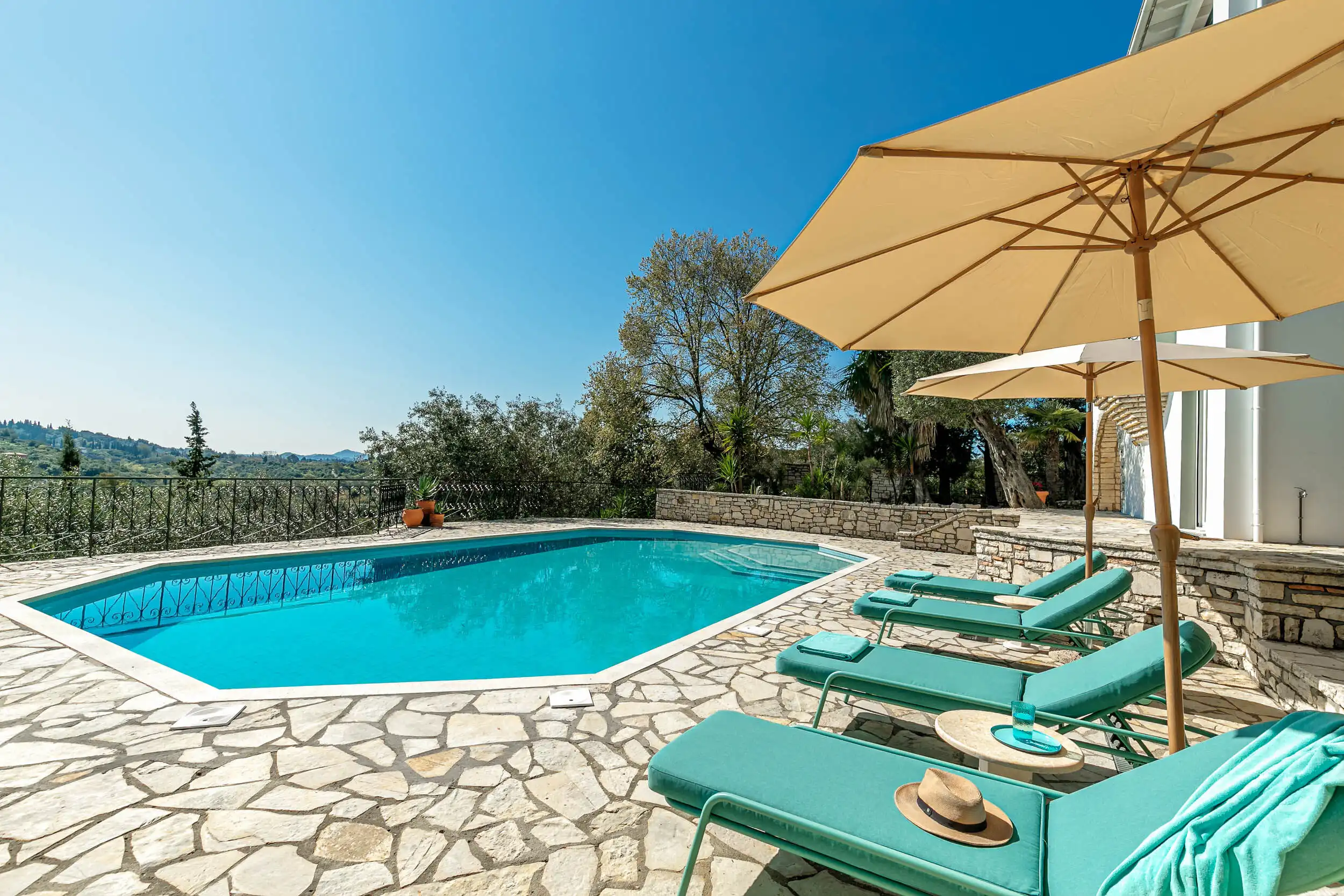 View Villa Pool in Gouvia, Corfu Beautiful outdoor pool with sea views in a renovated villa near Gouvia Marina. Perfect for relaxing.